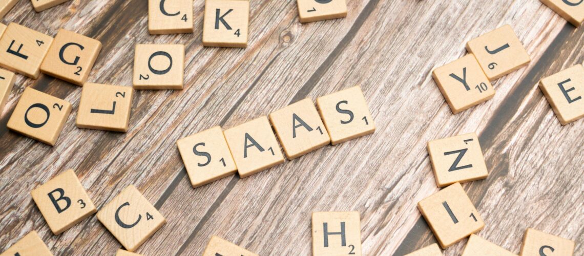 scrabble-letters-spelling-saas-on-a-wooden-tabl