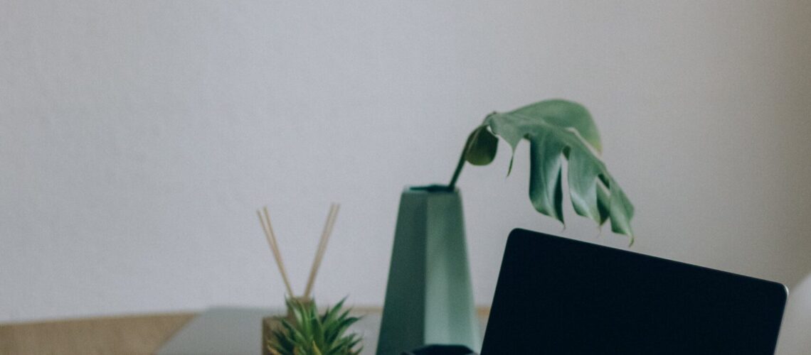 Free Black Laptop Computer On Brown Wooden Table Stock Photo