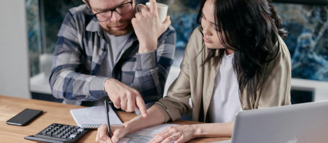 Free couple calculating al their bills stock photo