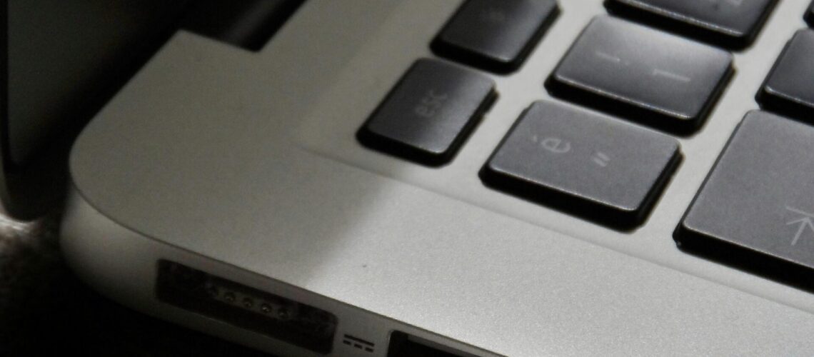 Free Detailed view of a silver laptop showing keyboard and multiple ports. Stock Photo